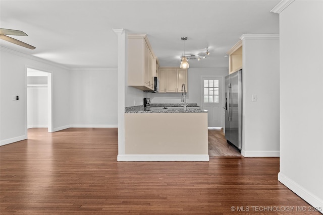 5729 E 24th Pl S, Tulsa, OK 74114 - kitchen with a ceiling fan, crown molding, appliances with stainless steel finishes, and dark wood-type flooring