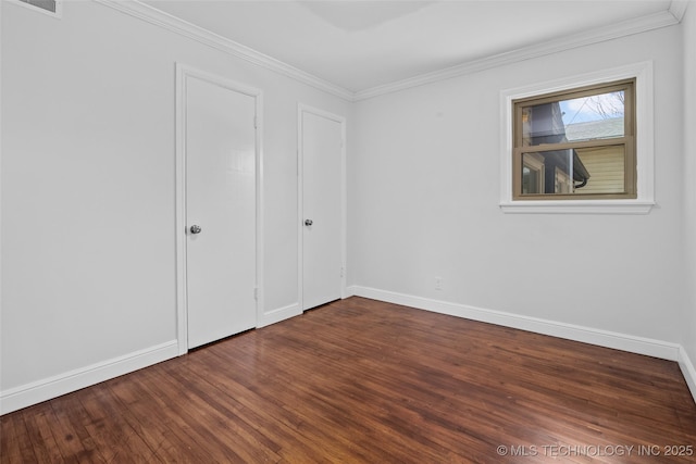 5729 E 24th Pl S, Tulsa, OK 74114 - unfurnished bedroom featuring baseboards, wood finished floors, and crown molding