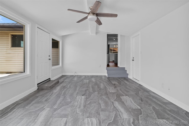 5729 E 24th Pl S, Tulsa, OK 74114 - spare room with baseboards, lofted ceiling with beams, and ceiling fan