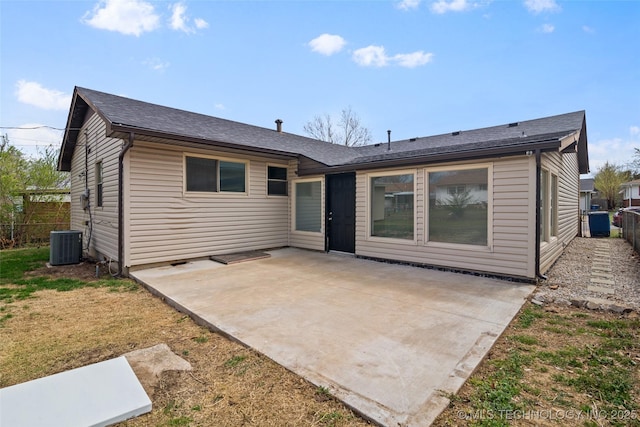 5729 E 24th Pl S, Tulsa, OK 74114 - back of house with central AC unit, fence, a patio, and roof with shingles