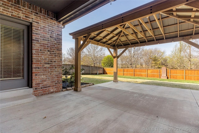 view of patio with a gazebo and a fenced backyard