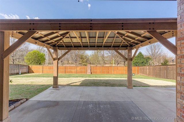 view of patio featuring a gazebo and a fenced backyard