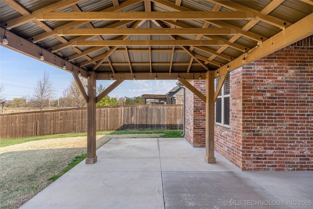 view of patio / terrace featuring fence and a gazebo