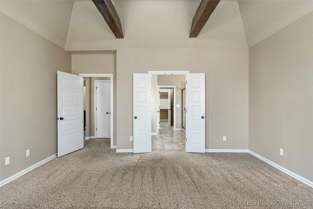 unfurnished bedroom with baseboards, high vaulted ceiling, beamed ceiling, and carpet flooring