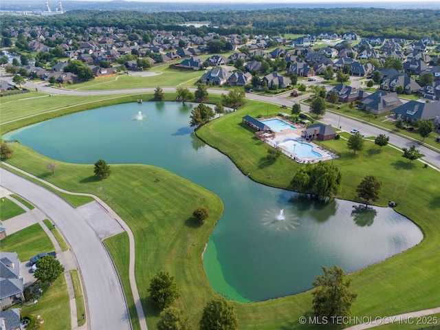 birds eye view of property featuring a residential view and a water view