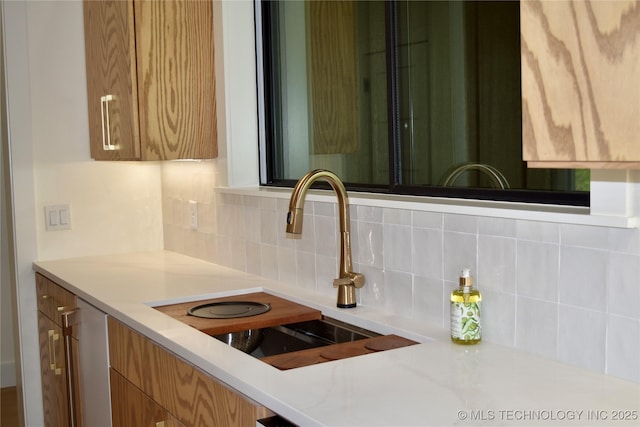 30303 E 59th St S, Broken Arrow, OK 74014 - kitchen with backsplash and light countertops