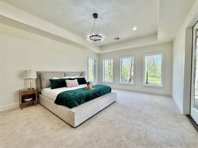 30303 E 59th St S, Broken Arrow, OK 74014 - bedroom with a chandelier, carpet, a raised ceiling, and recessed lighting