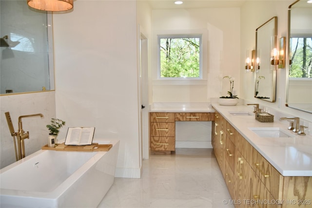 30303 E 59th St S, Broken Arrow, OK 74014 - bathroom with a freestanding tub, double vanity, and marble finish floors