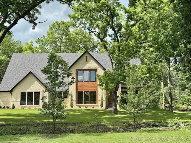 30303 E 59th St S, Broken Arrow, OK 74014 - view of front of house with a shingled roof and a front yard