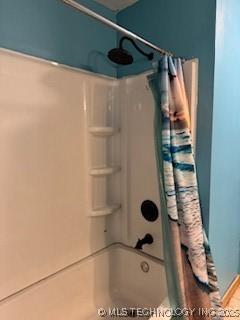 full bath with a shower with curtain