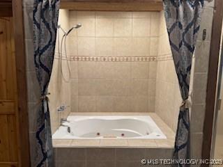 full bath featuring tiled shower / bath combo
