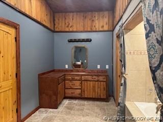 bathroom with a bathing tub and curtained shower
