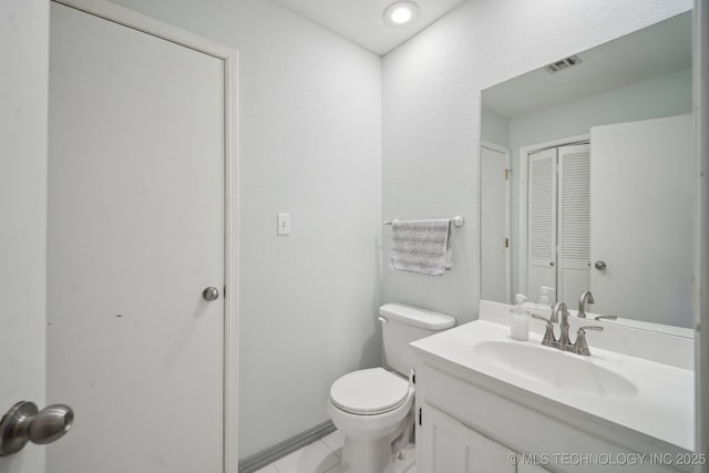 2936 E 84th St Unit 38, Tulsa, OK 74137 - bathroom with toilet, a closet, and vanity