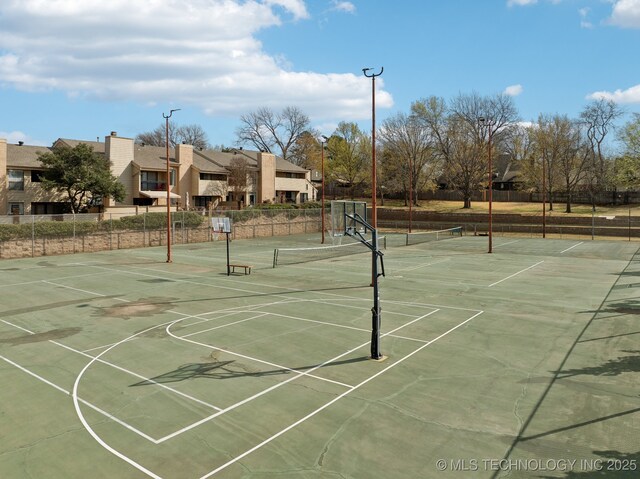 2936 E 84th St Unit 38, Tulsa, OK 74137 - view of tennis court with community basketball court and a residential view