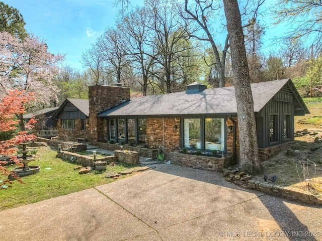 1645 Marian Ln, Eufaula, OK 74432 - view of front of property with a chimney, a shingled roof, and stone siding