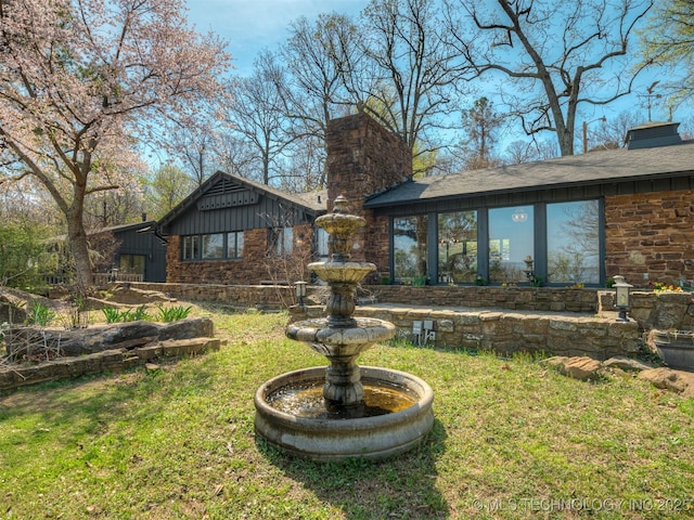 1645 Marian Ln, Eufaula, OK 74432 - view of front of house featuring a chimney, board and batten siding, and a front yard