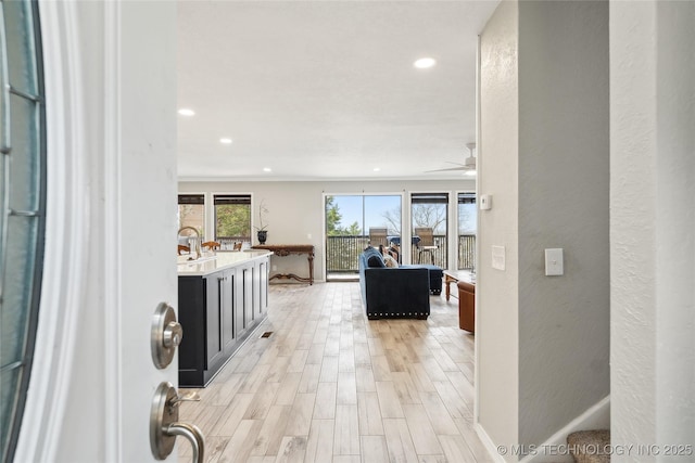 42 Diamond Head Dr Unit 42, Sand Springs, OK 74063 - corridor with recessed lighting, light wood finished floors, a textured wall, and baseboards