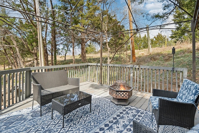 42 Diamond Head Dr Unit 42, Sand Springs, OK 74063 - wooden terrace featuring an outdoor fire pit