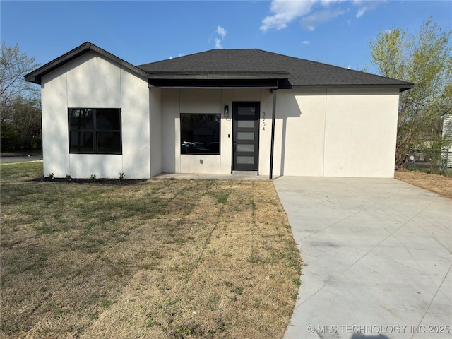 3204 N Hartford Ave, Tulsa, OK 74106 - view of front of property featuring a front yard, stucco siding, and roof with shingles