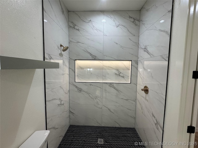3204 N Hartford Ave, Tulsa, OK 74106 - bathroom featuring a marble finish shower and toilet