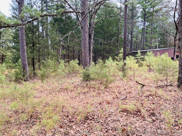 413822 S Sherman, Moyers, OK 74557 - view of landscape featuring a wooded view