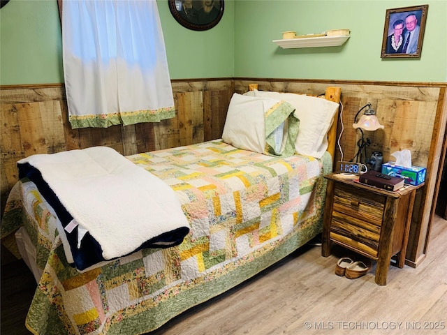 413822 S Sherman, Moyers, OK 74557 - bedroom with wood finished floors and wainscoting