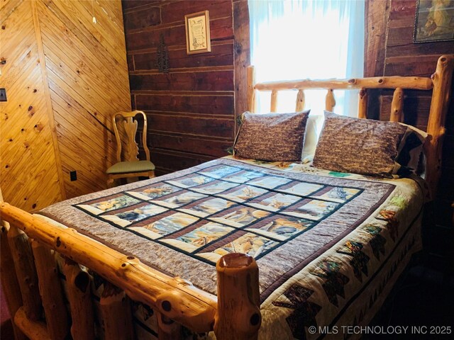413822 S Sherman, Moyers, OK 74557 - bedroom featuring wood walls