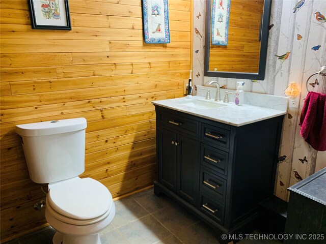 413822 S Sherman, Moyers, OK 74557 - bathroom with wooden walls, toilet, and vanity