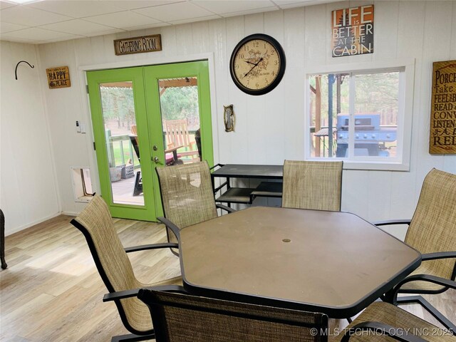 413822 S Sherman, Moyers, OK 74557 - dining room featuring a drop ceiling, wood finished floors, french doors, and plenty of natural light