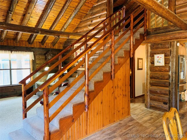 413822 S Sherman, Moyers, OK 74557 - stairs with vaulted ceiling with beams, wood finished floors, wooden walls, and wooden ceiling