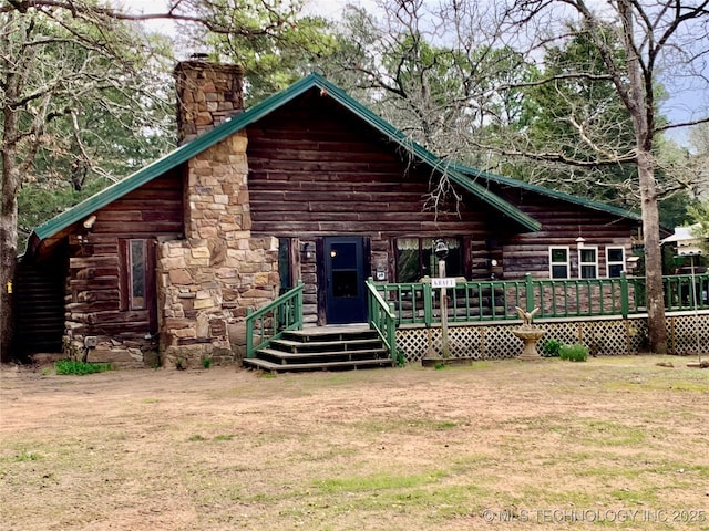 413822 S Sherman, Moyers, OK 74557 - back of property with log siding, a lawn, a deck, and a chimney