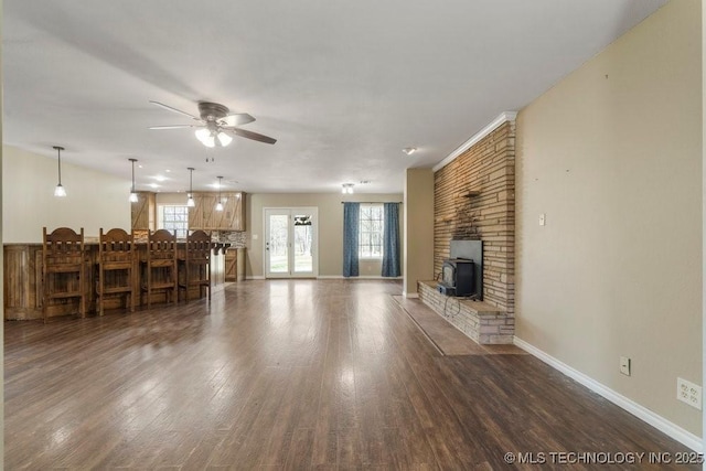 9012 S 49th W Ave, Tulsa, OK 74131 - living room with a healthy amount of sunlight, baseboards, a ceiling fan, and wood finished floors