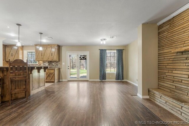 9012 S 49th W Ave, Tulsa, OK 74131 - unfurnished living room with visible vents, baseboards, and dark wood finished floors