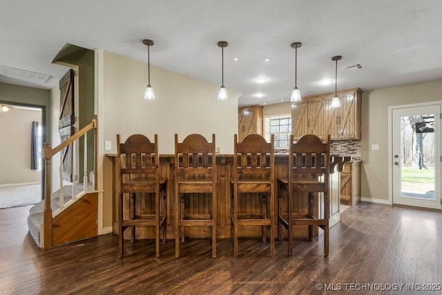 9012 S 49th W Ave, Tulsa, OK 74131 - dining room featuring baseboards, recessed lighting, stairway, dark wood-style floors, and visible vents