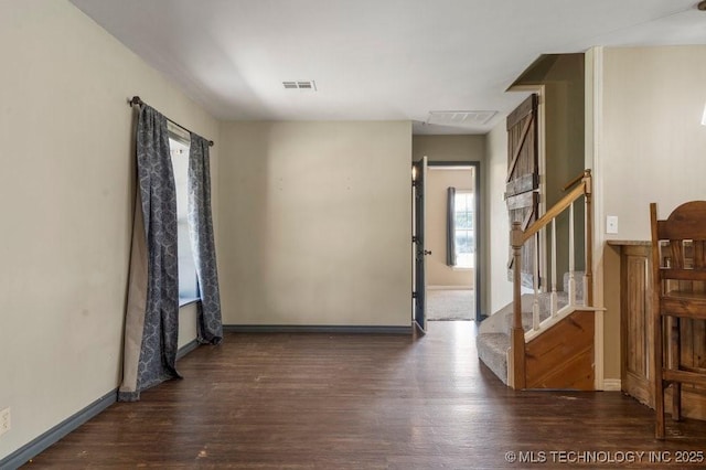 9012 S 49th W Ave, Tulsa, OK 74131 - spare room with wood finished floors, baseboards, visible vents, and stairs
