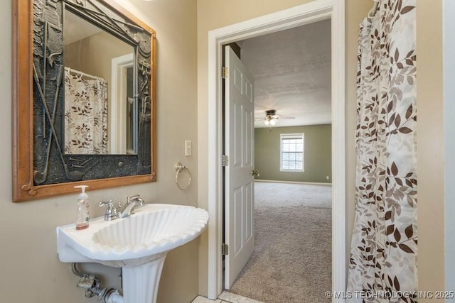 9012 S 49th W Ave, Tulsa, OK 74131 - bathroom with a sink and ceiling fan