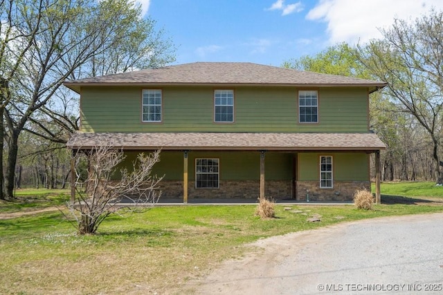 9012 S 49th W Ave, Tulsa, OK 74131 - farmhouse inspired home with a front yard, roof with shingles, and stone siding