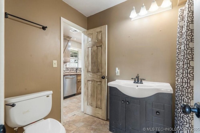 9012 S 49th W Ave, Tulsa, OK 74131 - bathroom featuring visible vents, toilet, and vanity