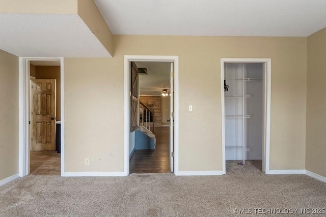 9012 S 49th W Ave, Tulsa, OK 74131 - unfurnished bedroom with a spacious closet, carpet, baseboards, and a closet
