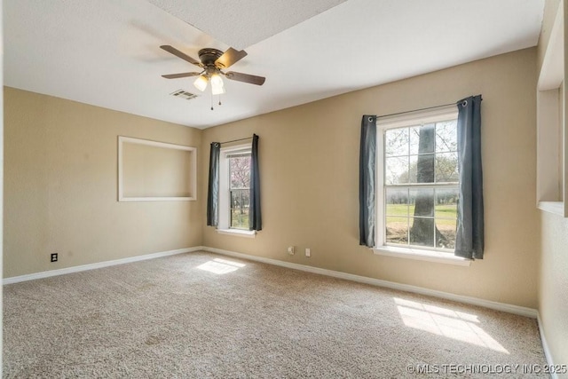 9012 S 49th W Ave, Tulsa, OK 74131 - carpeted spare room featuring visible vents, baseboards, and a ceiling fan