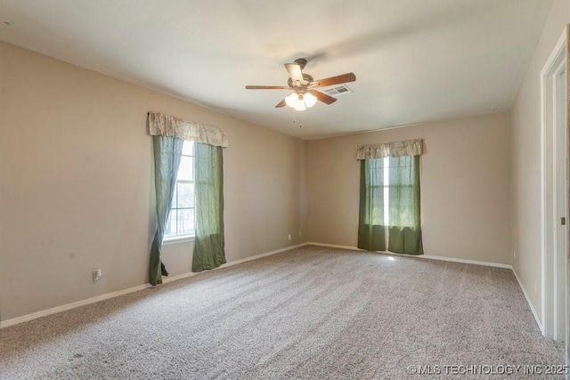 9012 S 49th W Ave, Tulsa, OK 74131 - spare room featuring visible vents, baseboards, a ceiling fan, and carpet floors