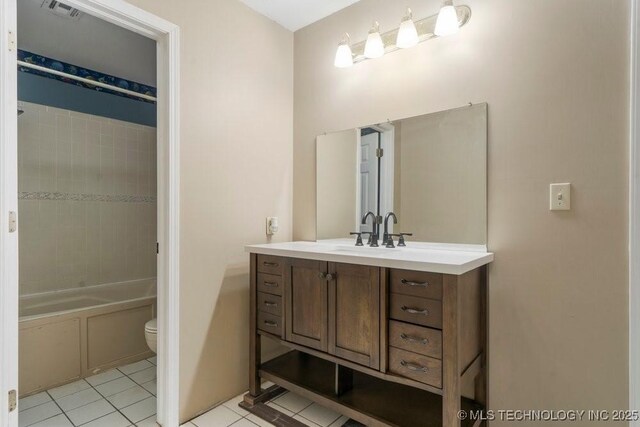 9012 S 49th W Ave, Tulsa, OK 74131 - bathroom with vanity, visible vents,  shower combination, toilet, and tile patterned floors