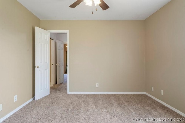 9012 S 49th W Ave, Tulsa, OK 74131 - empty room featuring baseboards, a ceiling fan, and carpet