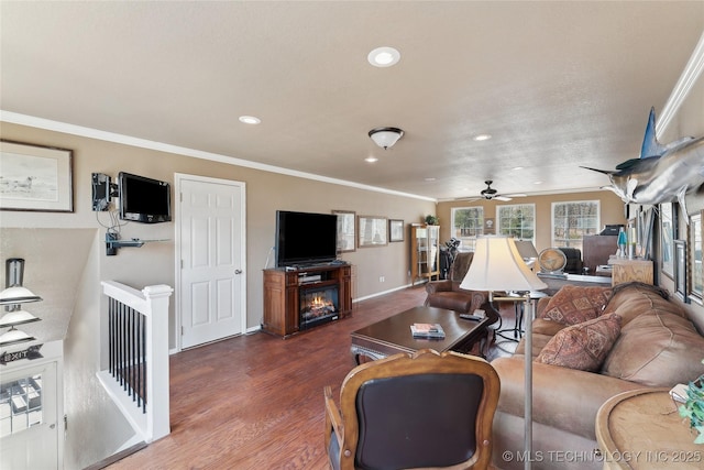 20136 W Chicken Creek Rd, Cookson, OK 74427 - living room with ornamental molding, wood finished floors, recessed lighting, a glass covered fireplace, and a ceiling fan