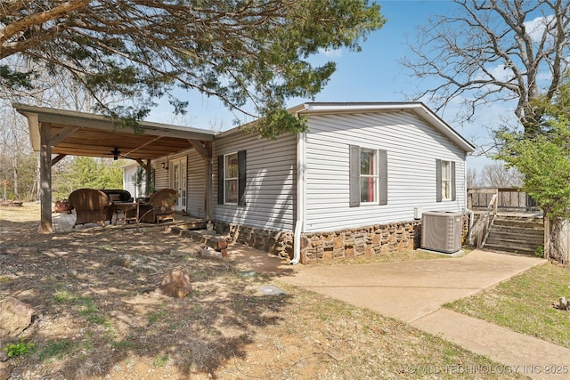 20136 W Chicken Creek Rd, Cookson, OK 74427 - view of home's exterior featuring ceiling fan and a cooling unit