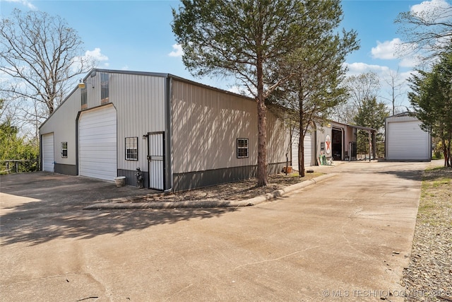 20136 W Chicken Creek Rd, Cookson, OK 74427 - view of front facade with an outbuilding and a garage