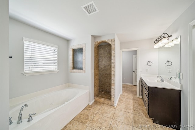 bathroom featuring a tub with jets, double vanity, and a tile shower