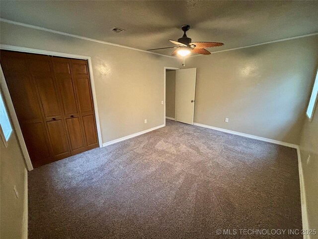 112 S 7th St, Eufaula, OK 74432 - unfurnished bedroom with carpet flooring, a closet, baseboards, and ceiling fan