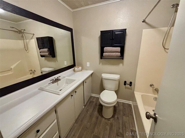 112 S 7th St, Eufaula, OK 74432 - bathroom featuring crown molding, wood finished floors, vanity, shower / bath combination, and toilet