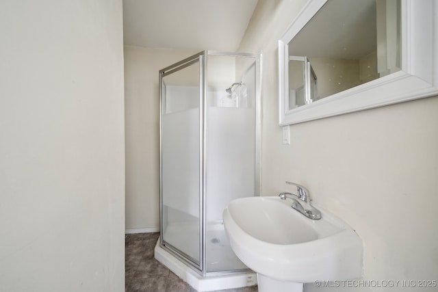 full bathroom with a sink and a stall shower